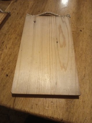 Targa in legno La donna è come la terra