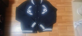 Chaqueta de paño azul marino con grullas