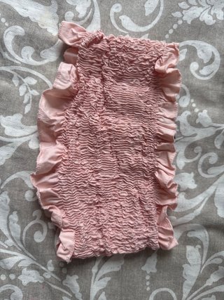 Top rosa fruncido con volantes