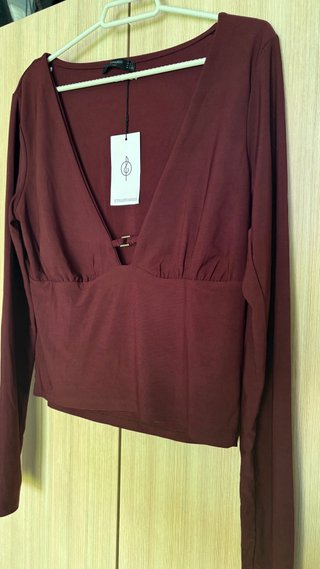 Top Stradivarius manga larga escote pico
