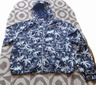 Chubasquero unisex estampado palmeras