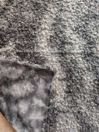 Tejido peludo gris