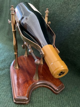 Antica culla per vino in ottone e legno