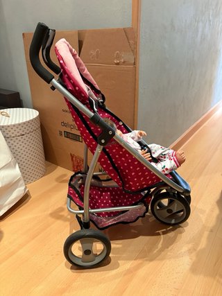 Carro de muñecas rosa con mariposas