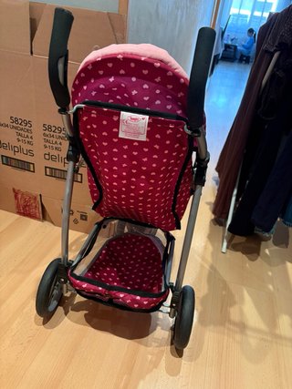 Carro de muñecas rosa con mariposas