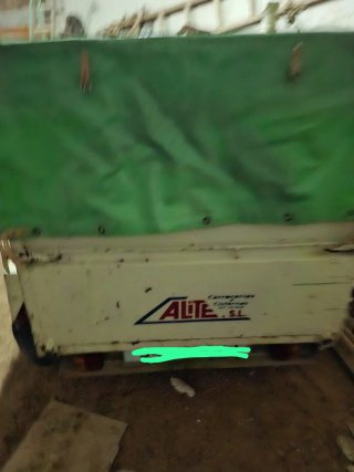 Remolque coche con lona verde