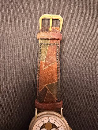 Reloj de pulsera dorado y multicolor de tissot