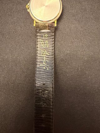 Reloj de pulsera dorado y multicolor de tissot