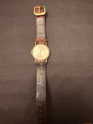 Reloj de pulsera dorado y multicolor de tissot