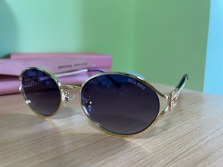 Gafas de Sol Miu Miu Doradas y Negras