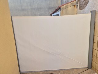 Toldo lateral beige de tela