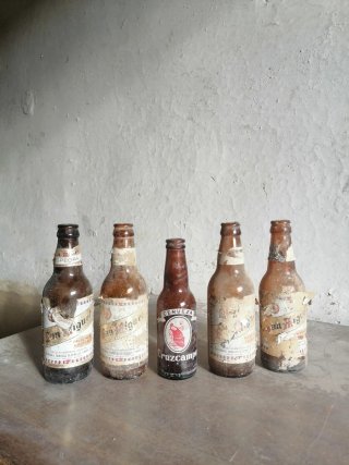 Lotto di 5 bottigliette antiche Cruzcampo e San Miguel