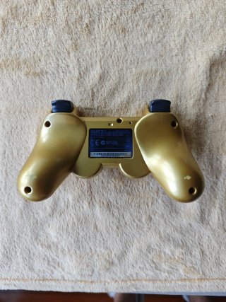 Consola PS3 Negra con 7 Juegos y Mando Dorado