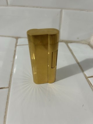 Mechero antiguo bañado en oro