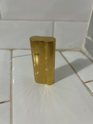 Mechero antiguo bañado en oro