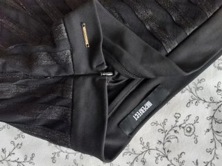Pantaloni neri a righe trasparenti