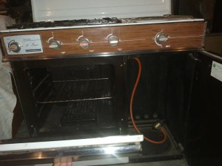 Cocina de gas con horno y vitrocerámica