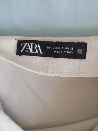 Conjunto falda pantalon con lazo beige y blusa