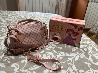 Bolso infantil rosa con accesorios