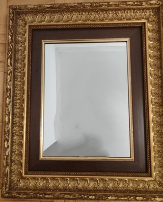 Espejo de pared dorado y marrón