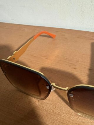 Gafas de sol Hermes doradas y marrones