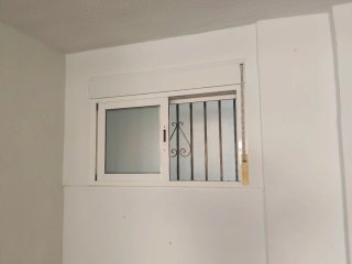 Ventana con persiana enrollable