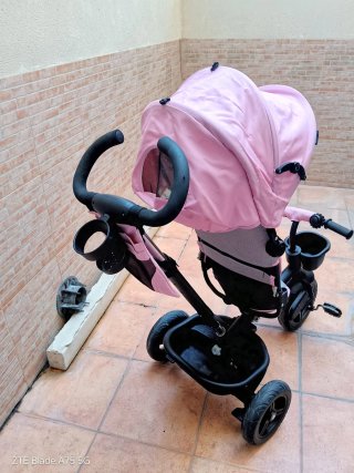 Triciclo infantil rosa con capota
