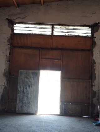 Puerta de garaje seccional plegable