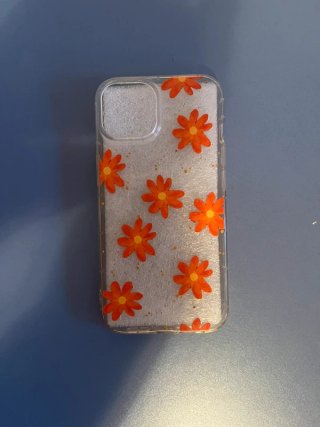 Funda transparente con flores naranjas