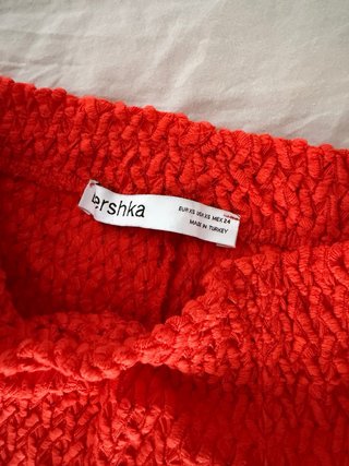 Pantalón de punto naranja acampanado