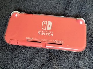 Nintendo Switch Lite coral + Accessori