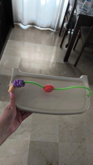 Columpio para bebé con juguetes