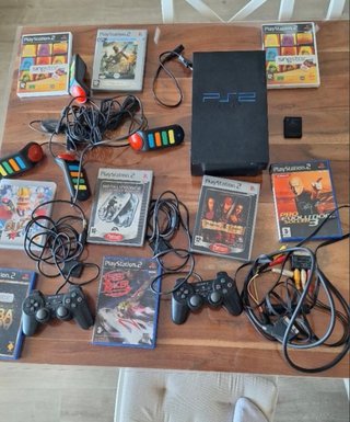 PS2 Negra + 9 Juegos + Tarjeta Memoria