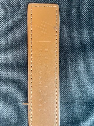 Funda portátil HP gris con asa y detalle piel