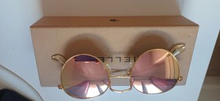 Gafas de sol Meller doradas y con cristal rosa