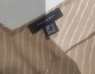 Blusa beige con rayas blancas