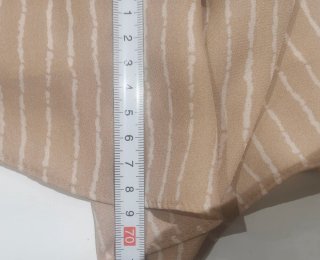 Blusa beige con rayas blancas