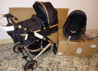 Carrito de bebé y silla coche negro