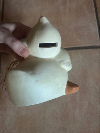 Salvadanaio a forma di papera in ceramica