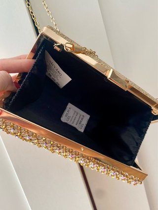 Bolso de fiesta dorado con pedrería
