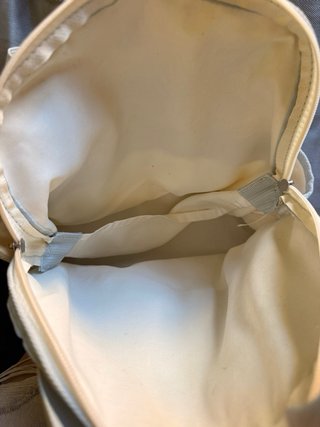 Mochila beige y azul con gatitos