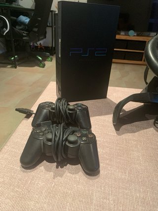 Console PS1 e PS2 con accessori
