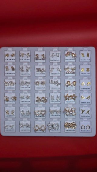 Lote 36 pendientes acero plata y dorado