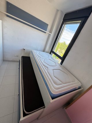 Cama nido de madera y tela