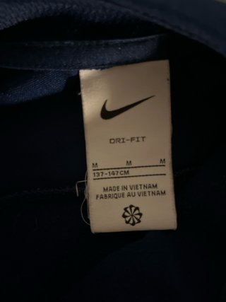 Chaqueta Nike azul y amarillo Talla m niño