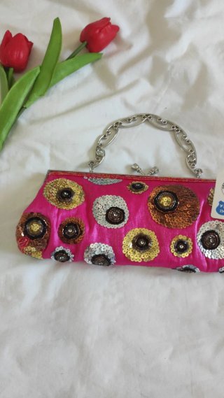 Bolso de fiesta rosa con lentejuelas