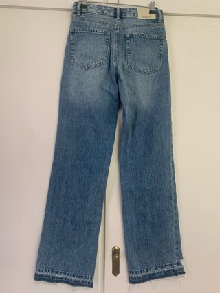 Pantalón vaquero ancho desgastado