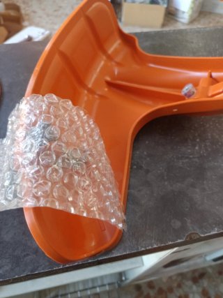 Protector cabezal desbrozadora Stihl naranja
