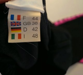 Pantaloni sportivi Arena neri con banda rosa