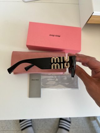 Occhiali da sole Miu Miu donna neri e dorati